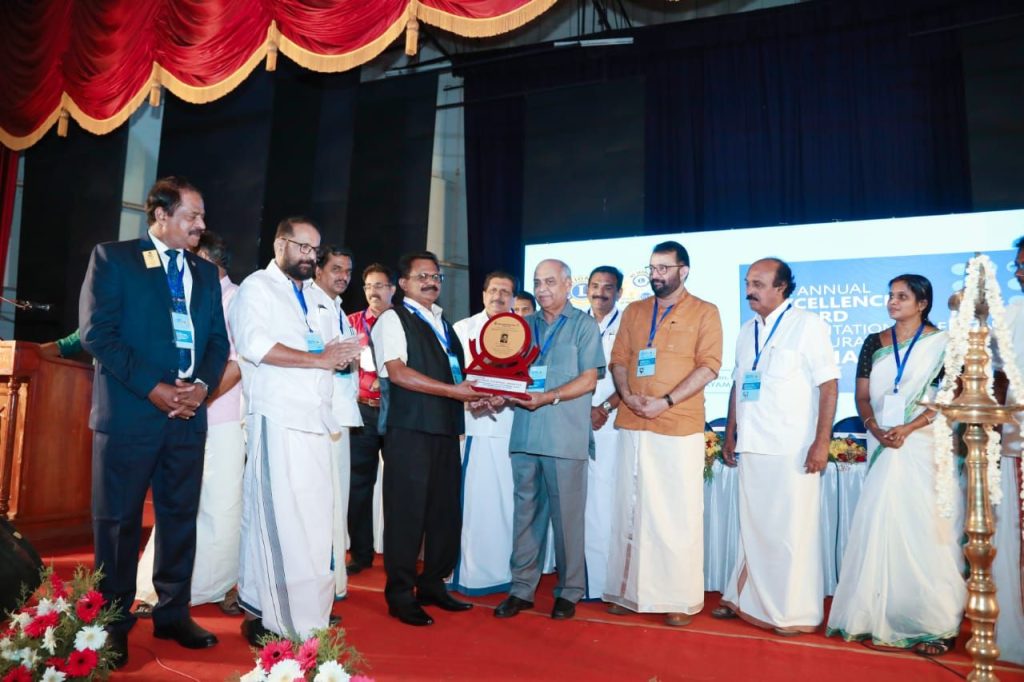 RECEIVING EXCELENCE IN PRIVATE COLLEGE EDUCATION AWARD FROM JUSTICE CYRIAC JOSEPH